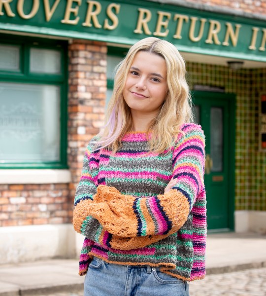 Sydney Martin in character as Betsy Swain in Coronation Street outside the Rovers